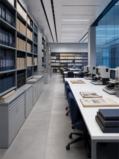 The document archive, with bound volumes on open shelving and reading desks.